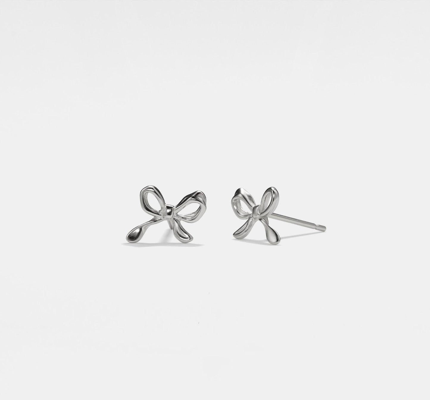 Tiny Gold Bow Stud Earrings in Silver